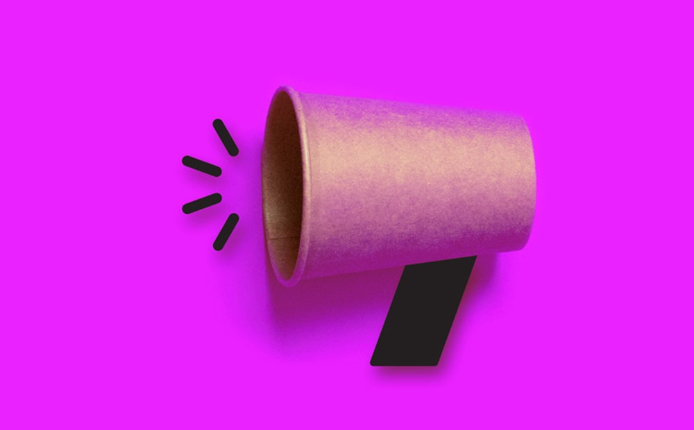 Hero image of a megaphone made out of a paper cup on a purple background