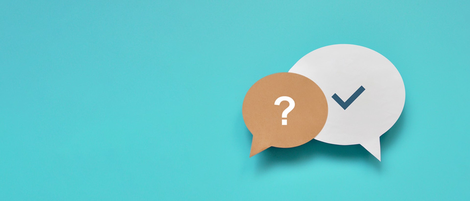 Two speech bubbles against a blue background, with the left one having a question mark and the right having a tick.