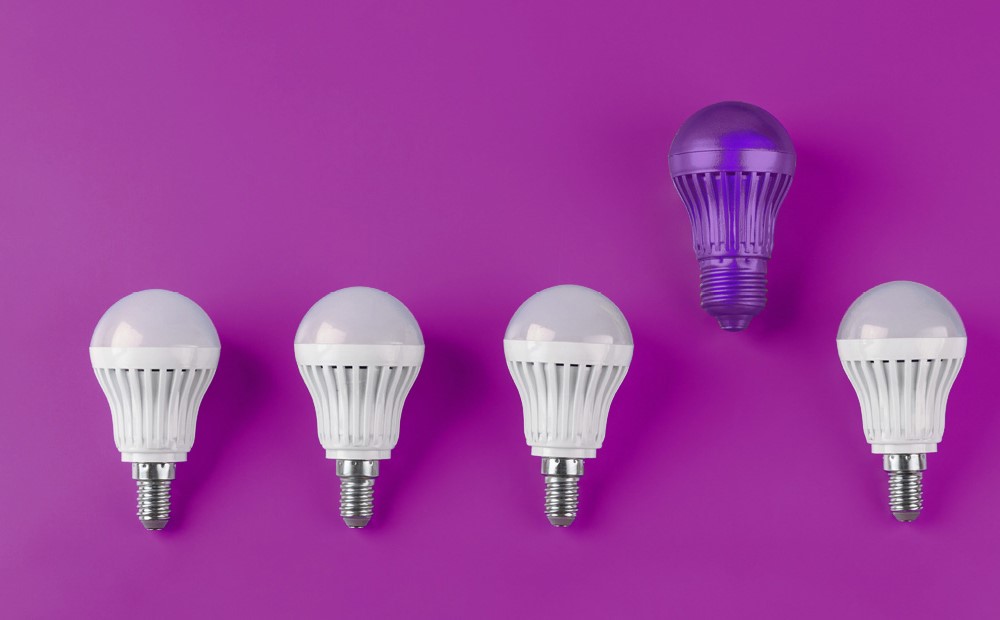 Image of environmentally friendly lightbulbs on a purple background