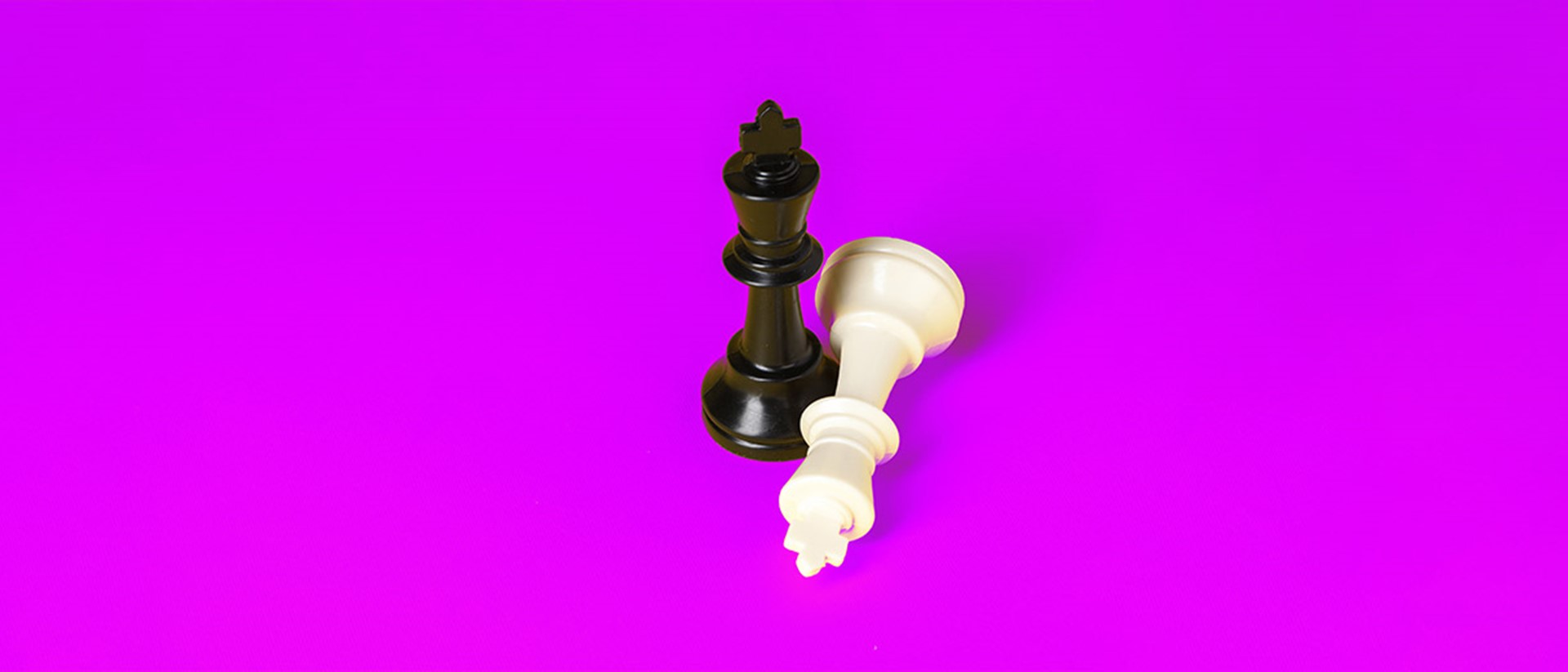 Hero image of chess pieces on a purple background
