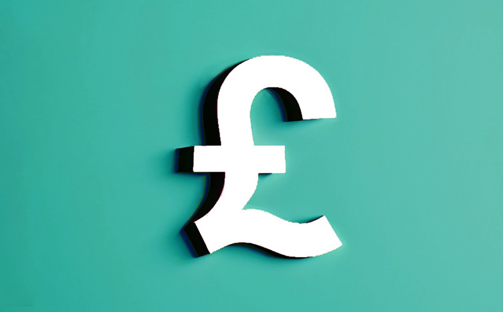 A white sterling pound symbol against a teal background