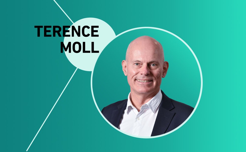 Terence Moll against a teal background