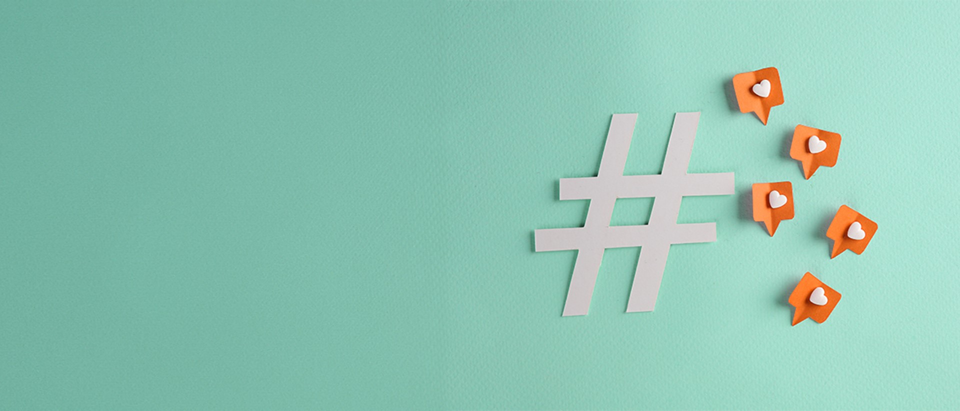 A white hashtag symbol with five social "like" icons to the right against a teal background