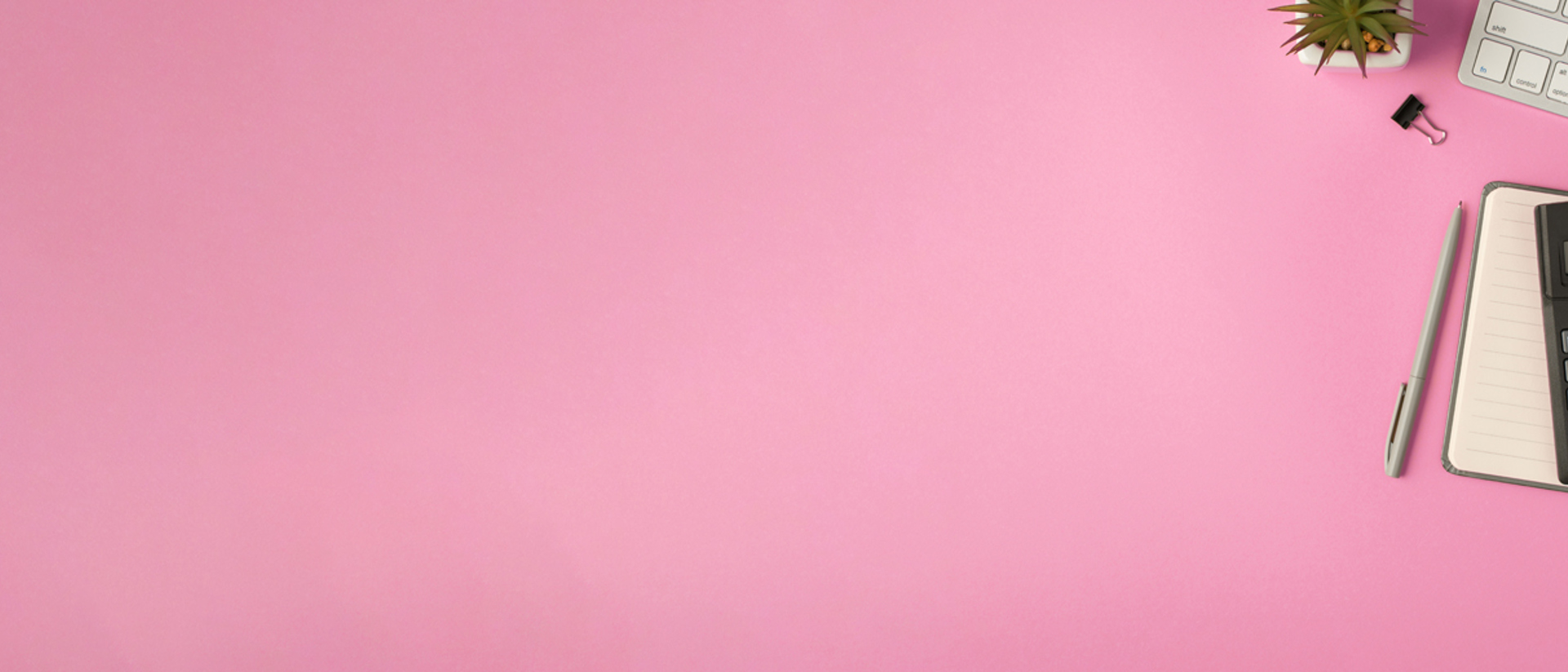 Image of a calculator and planner on a pink background