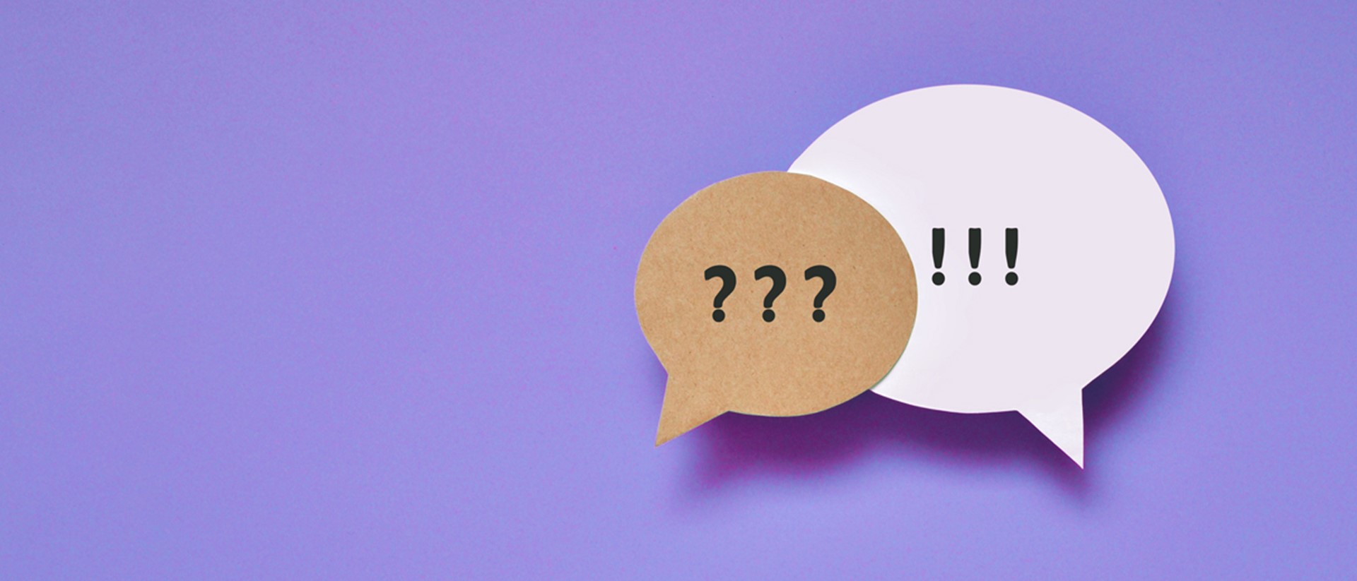 Image of two speech bubbles against a purple background