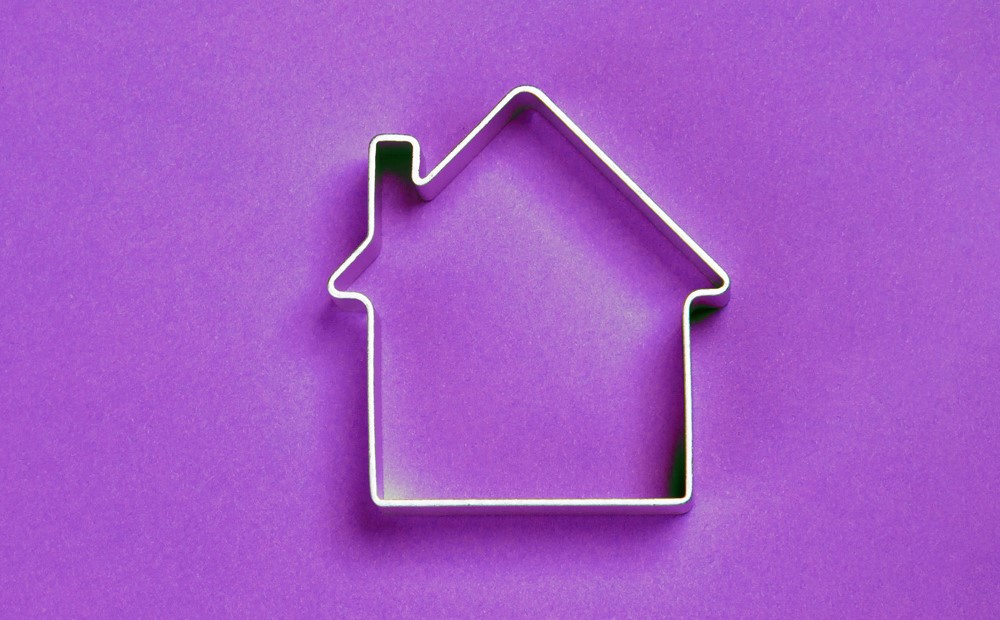 Outline of a house against a purple background