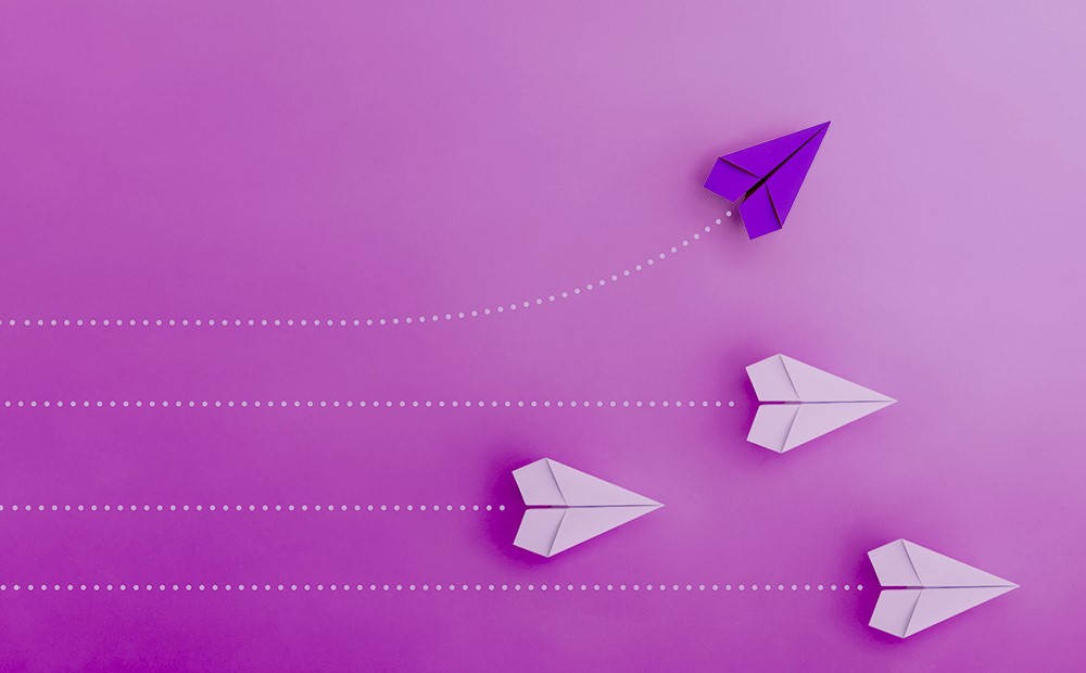 Image of purple and white paper airplanes