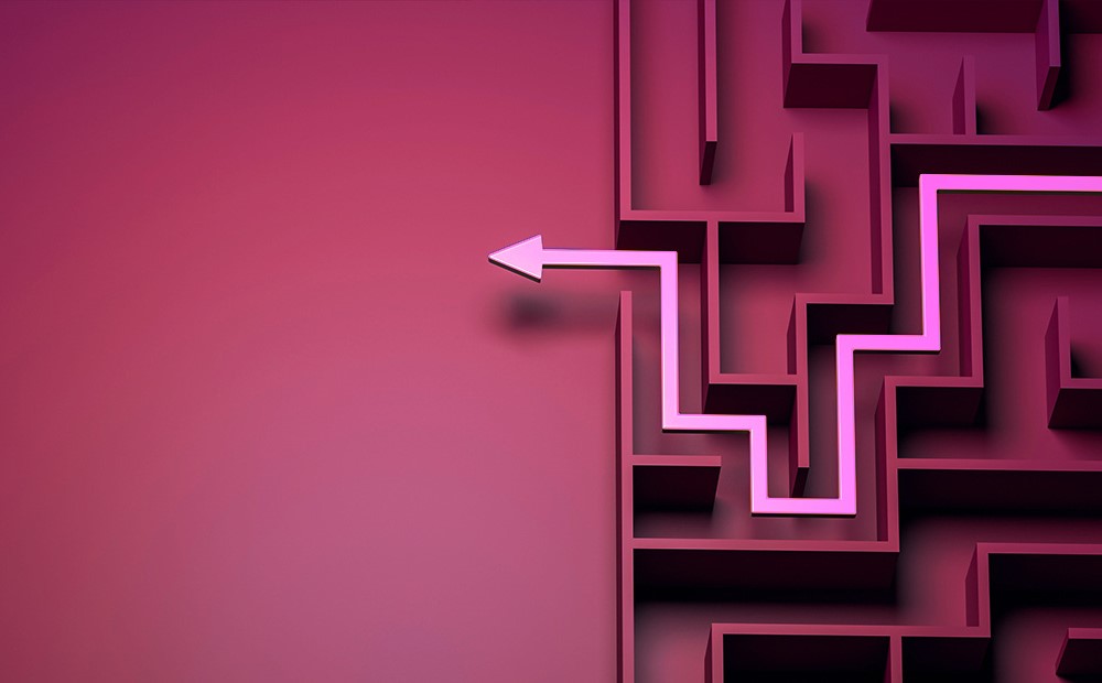 Image of a purple maze with a pink arrow navigating the maze
