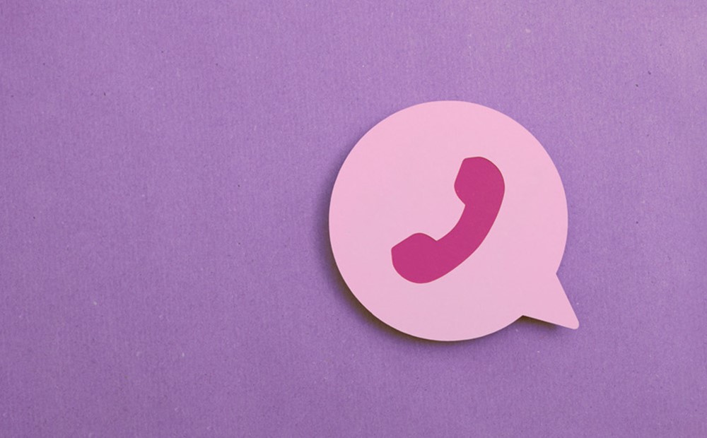 Image of a pink phone icon against a purple background