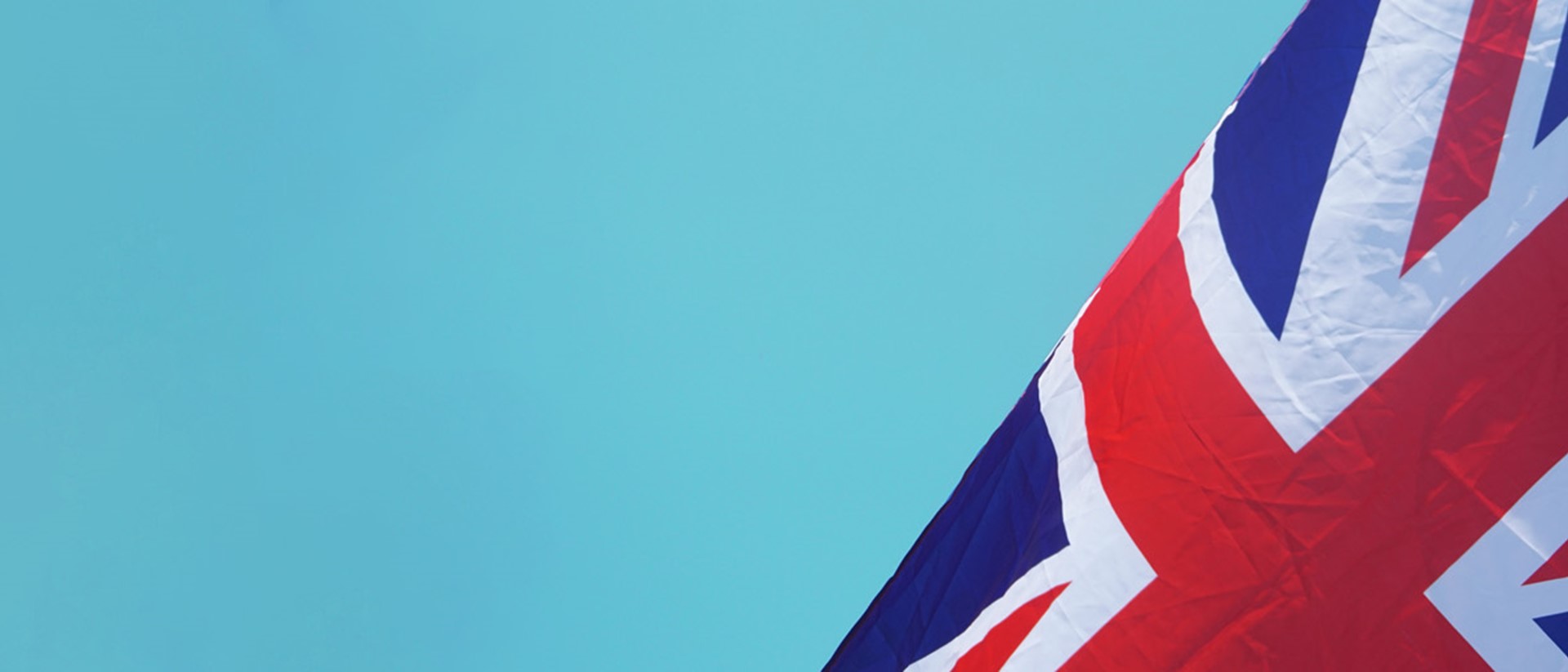 Image of a union jack flag against a blue background