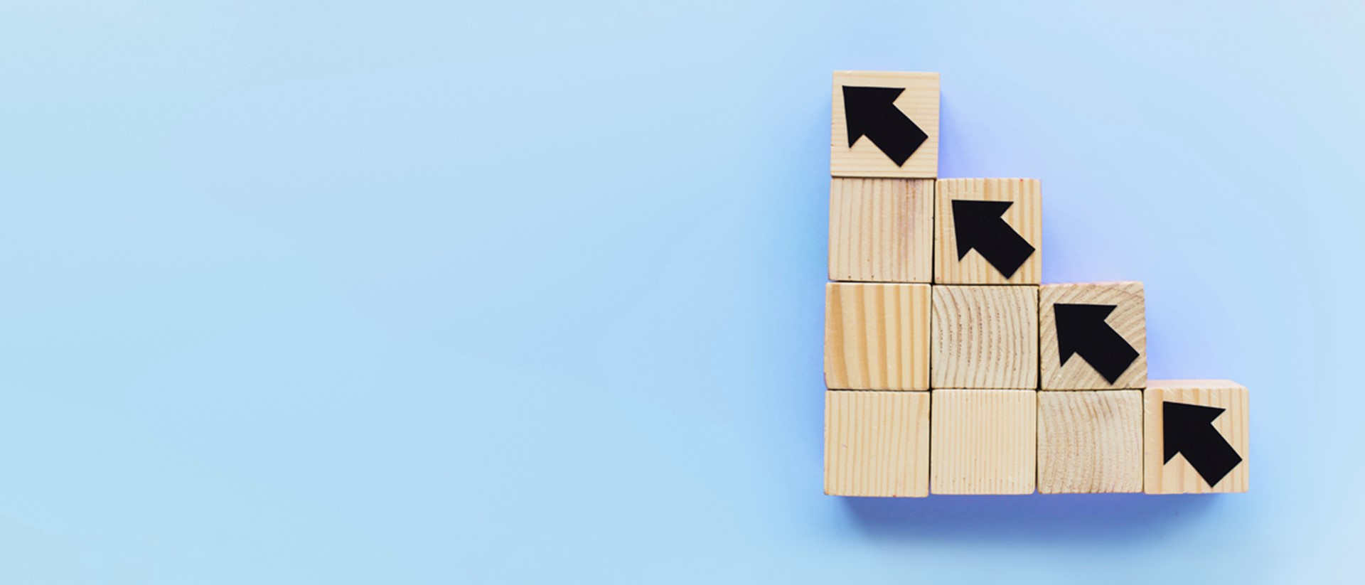 Image of wooden blocks going diagonally against a blue background
