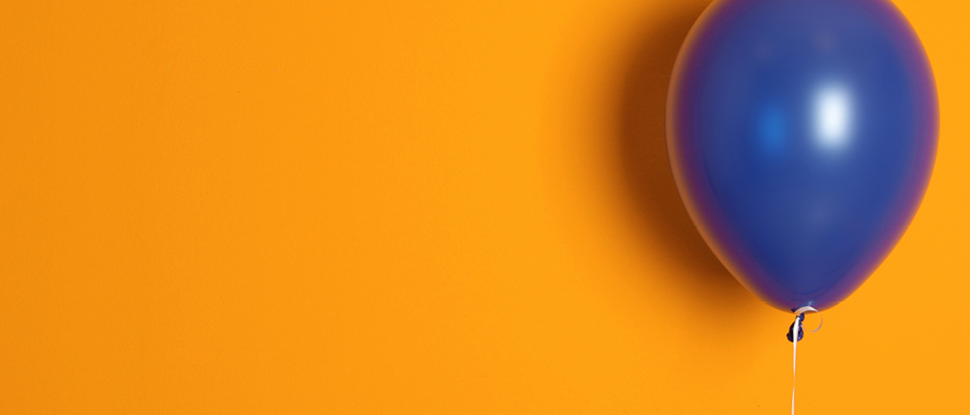 Image of a blue balloon on an orange background