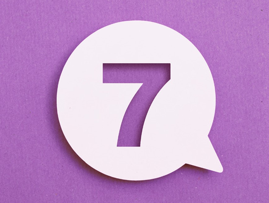 The number seven in a speech bubble against a purple background.