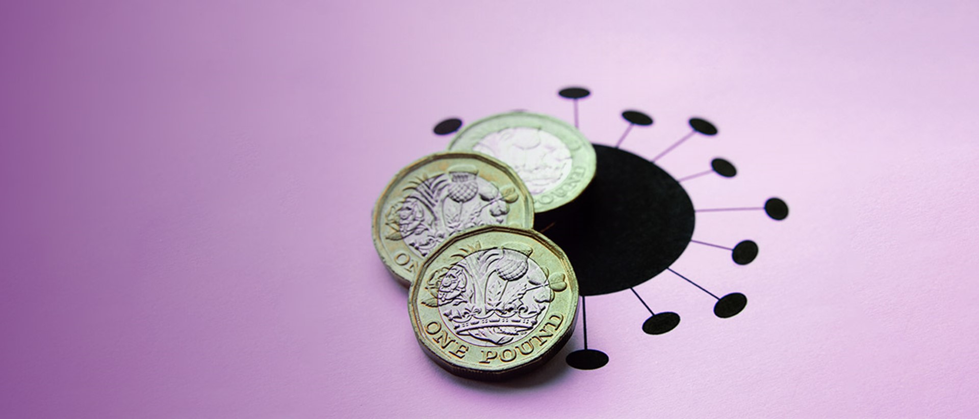 Image of pound coins on top of a black virus logo on a purple background