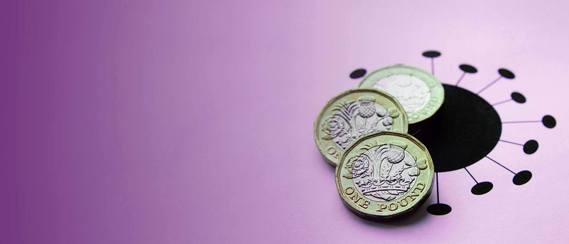 Image of pound coins on top of a black virus logo on a purple background