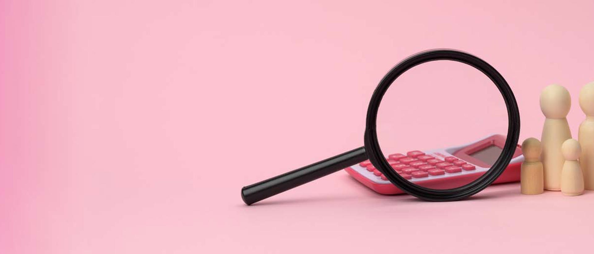 Image of a magnifying glass, calculator and wooden figures of people against a pink background