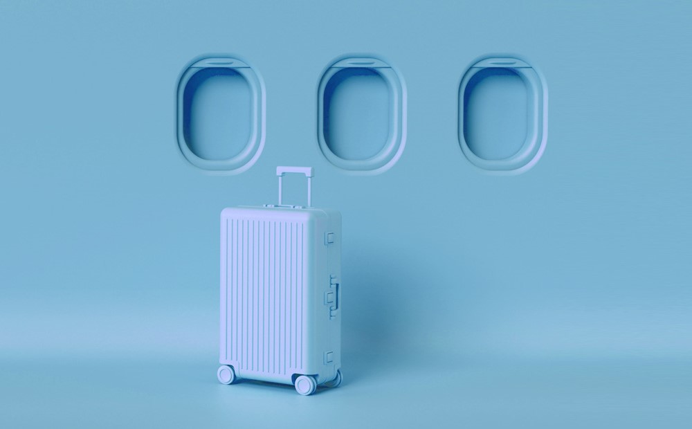 Image of a blue suitcase against a blue background